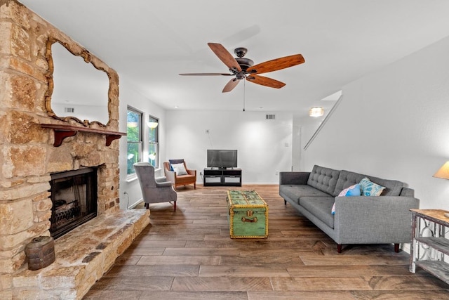 4304 Adelphi Ln, Austin, TX 78727 - living area featuring ceiling fan, wood finished floors, and a stone fireplace