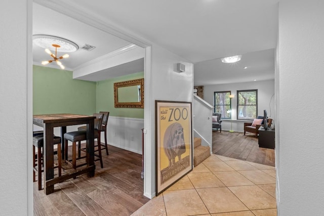 4304 Adelphi Ln, Austin, TX 78727 - hallway featuring stairs, a chandelier, and wood finished floors