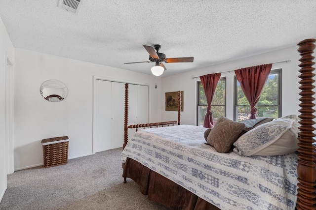 4304 Adelphi Ln, Austin, TX 78727 - bedroom with multiple windows, a closet, carpet, a textured ceiling, and ceiling fan