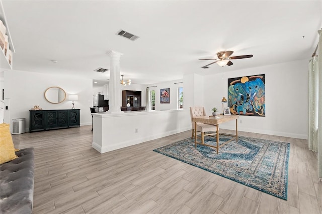 4410 Cisco Valley Dr, Round Rock, TX 78664 - home office featuring decorative columns, ceiling fan, and light wood-type flooring