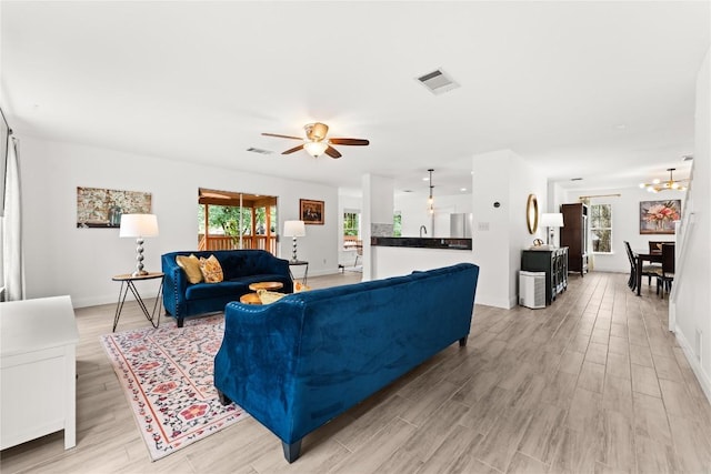 4410 Cisco Valley Dr, Round Rock, TX 78664 - living room with plenty of natural light, light wood-style flooring, and ceiling fan