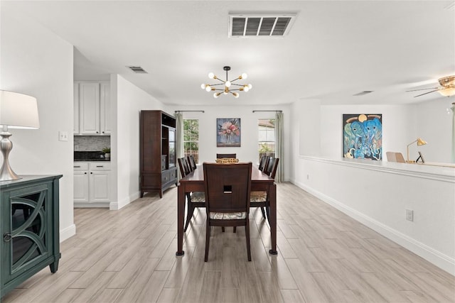 4410 Cisco Valley Dr, Round Rock, TX 78664 - dining space with a chandelier, light wood-style floors, and a ceiling fan