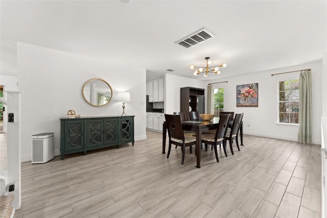 4410 Cisco Valley Dr, Round Rock, TX 78664 - dining room with a chandelier and light wood-style floors