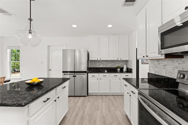 4410 Cisco Valley Dr, Round Rock, TX 78664 - kitchen with stainless steel appliances, white cabinets, recessed lighting, and decorative backsplash