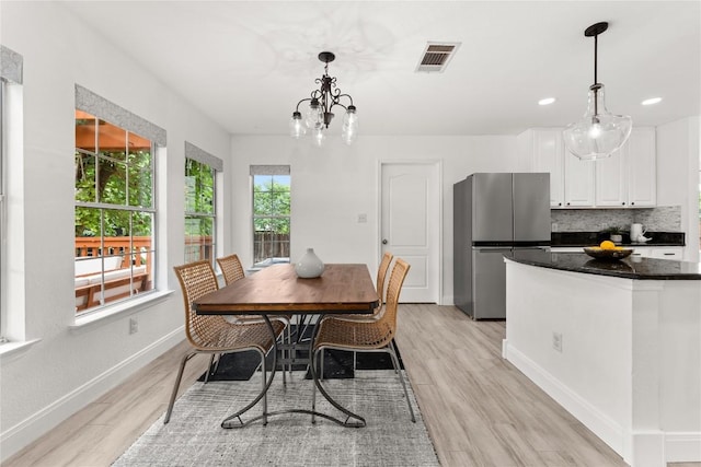 4410 Cisco Valley Dr, Round Rock, TX 78664 - dining space with light wood finished floors, a chandelier, and recessed lighting