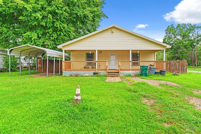 300 Walker St, Smithville, TX 78957 - view of front of property featuring covered porch, a front yard, and a carport