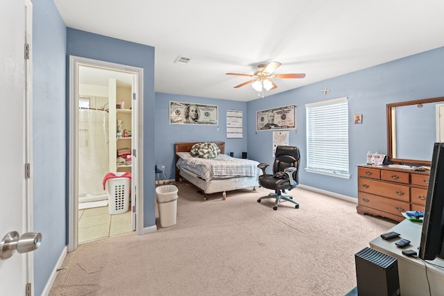 300 Walker St, Smithville, TX 78957 - carpeted bedroom with ceiling fan and connected bathroom