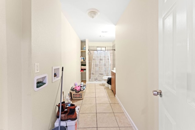 300 Walker St, Smithville, TX 78957 - corridor featuring light tile patterned floors and baseboards