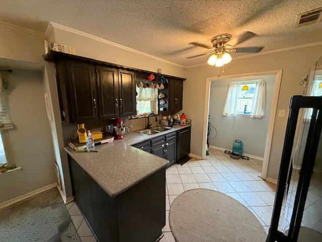 410 Phoenix Dr, Temple, TX 76504 - kitchen with black dishwasher, a ceiling fan, light tile patterned flooring, ornamental molding, and a peninsula