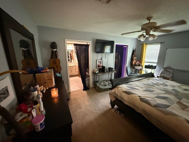 410 Phoenix Dr, Temple, TX 76504 - carpeted bedroom with ceiling fan, a textured ceiling, and ensuite bath