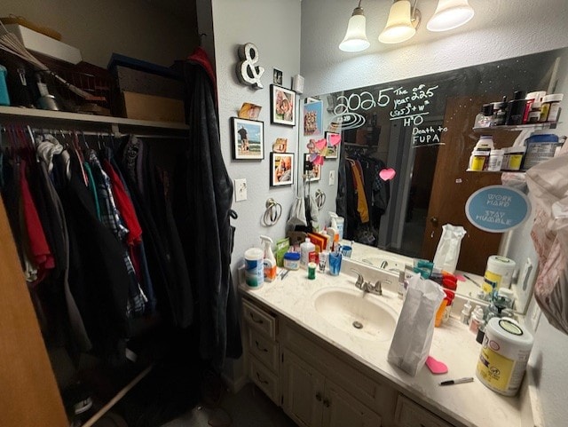 410 Phoenix Dr, Temple, TX 76504 - bathroom with vanity and a spacious closet
