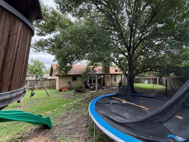 410 Phoenix Dr, Temple, TX 76504 - view of yard with a trampoline and a playground