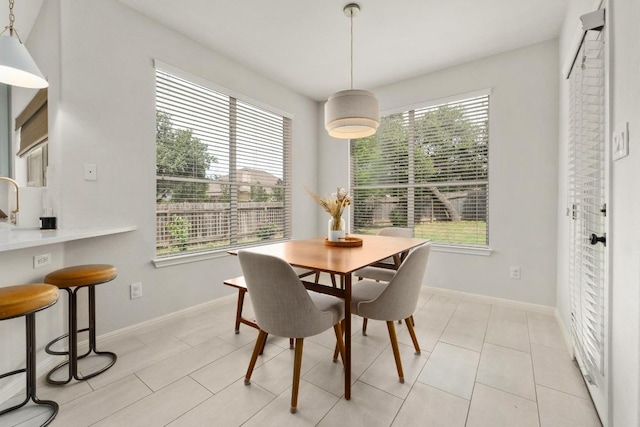 5701 Sunset Rdg, Austin, TX 78735 - dining area with healthy amount of natural light and light tile patterned flooring