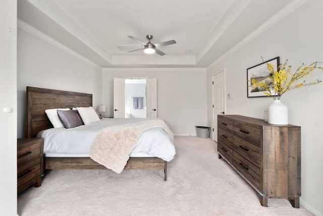 5701 Sunset Rdg, Austin, TX 78735 - bedroom with a tray ceiling, light colored carpet, ornamental molding, ceiling fan, and ensuite bath