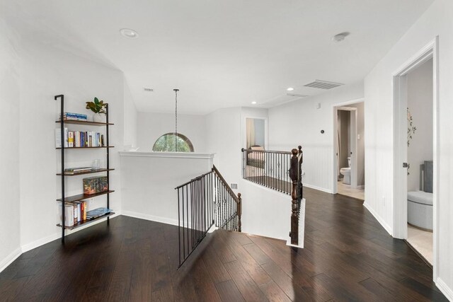 5701 Sunset Rdg, Austin, TX 78735 - corridor with an upstairs landing, hardwood / wood-style flooring, and recessed lighting