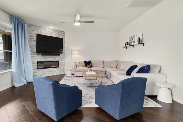 5701 Sunset Rdg, Austin, TX 78735 - living area with ceiling fan, a large fireplace, and wood finished floors