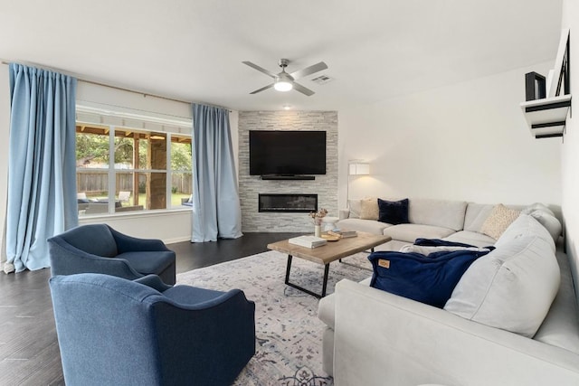 5701 Sunset Rdg, Austin, TX 78735 - living area featuring ceiling fan, dark wood finished floors, and a fireplace