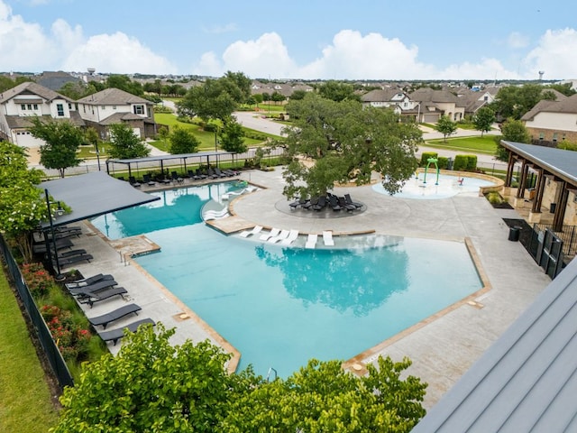 453 Arrowhead Vine St, Leander, TX 78641 - community pool featuring a residential view and a patio