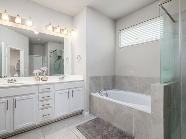 453 Arrowhead Vine St, Leander, TX 78641 - full bath with a bath, a stall shower, double vanity, and tile patterned flooring
