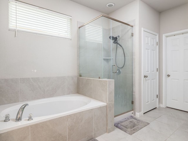 453 Arrowhead Vine St, Leander, TX 78641 - full bathroom with a bath, a stall shower, and tile patterned flooring