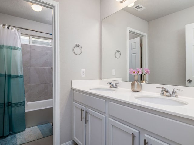 453 Arrowhead Vine St, Leander, TX 78641 - bathroom with double vanity and shower / tub combo