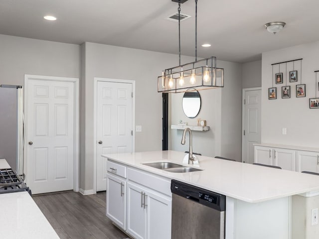 453 Arrowhead Vine St, Leander, TX 78641 - kitchen featuring stainless steel appliances, dark wood-type flooring, white cabinetry, light countertops, and recessed lighting