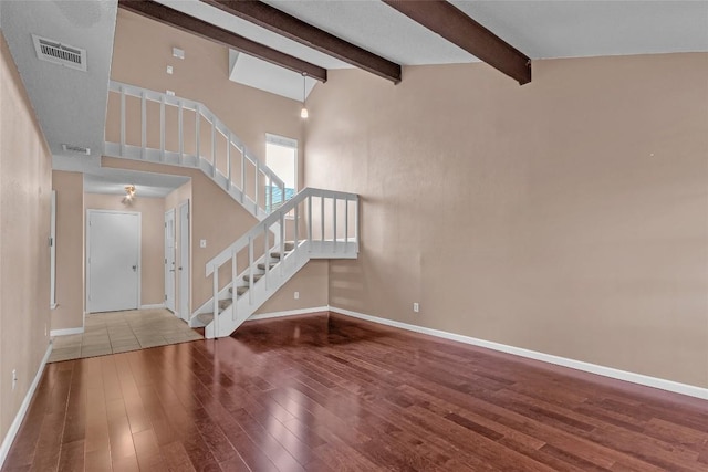 1028 Verbena Dr Unit 1144, Austin, TX 78750 - entrance foyer featuring wood finished floors, stairs, and beam ceiling