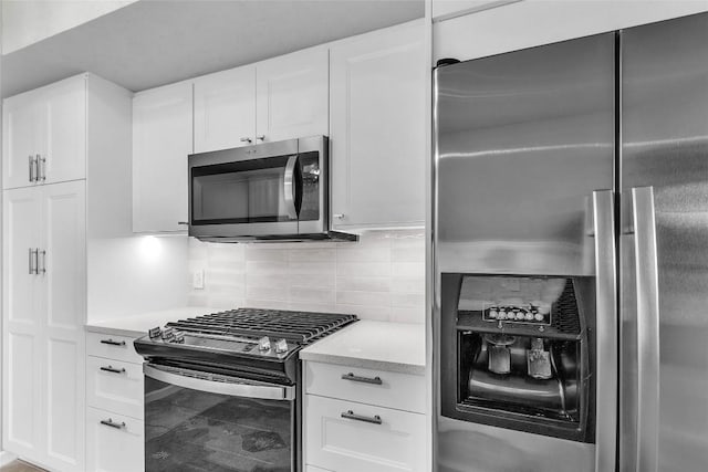 1028 Verbena Dr Unit 1144, Austin, TX 78750 - kitchen with stainless steel appliances, tasteful backsplash, white cabinetry, and light stone countertops