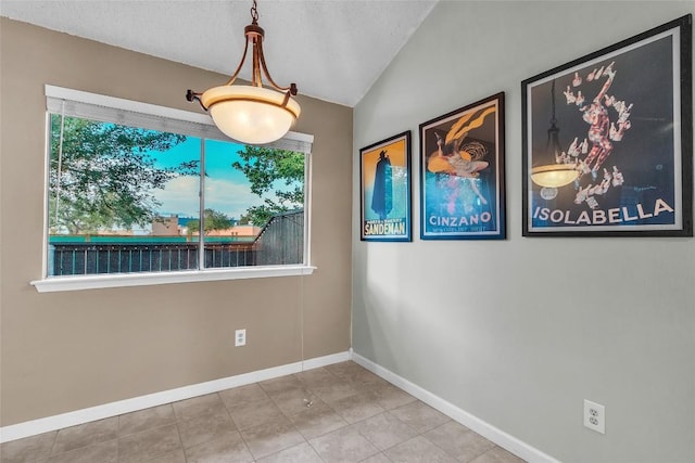 1028 Verbena Dr Unit 1144, Austin, TX 78750 - unfurnished dining area with lofted ceiling and tile patterned flooring