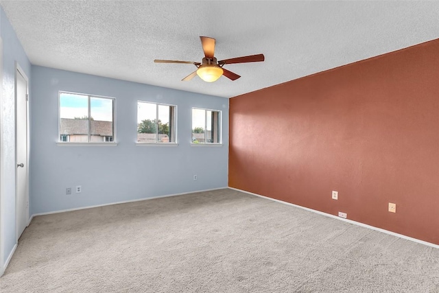 1028 Verbena Dr Unit 1144, Austin, TX 78750 - carpeted spare room with a ceiling fan, healthy amount of natural light, and a textured ceiling