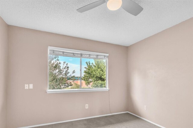 1028 Verbena Dr Unit 1144, Austin, TX 78750 - carpeted empty room with a ceiling fan and a textured ceiling