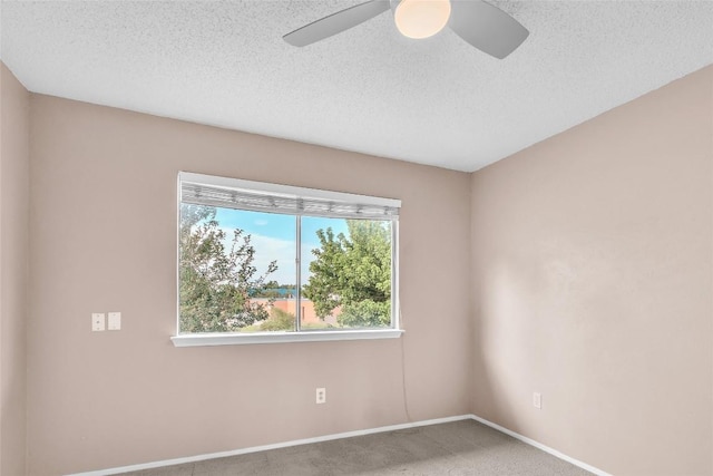 1028 Verbena Dr, Austin, TX 78750 - spare room featuring a ceiling fan, carpet, and a textured ceiling