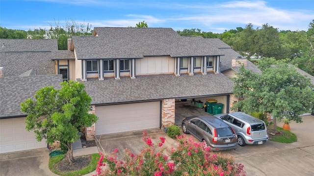 1028 Verbena Dr Unit 1144, Austin, TX 78750 - view of front of house featuring a shingled roof and concrete driveway