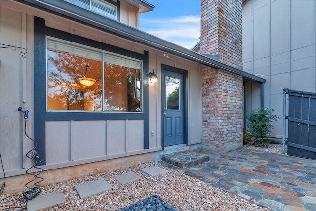 1028 Verbena Dr Unit 1144, Austin, TX 78750 - view of exterior entry with a chimney