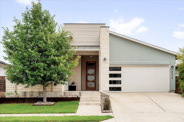 8213 Spire Vw, Austin, TX 78744 - view of front of house with driveway and a garage