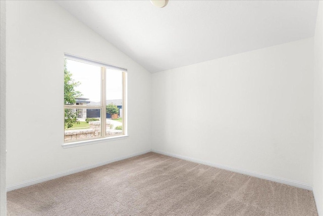 8213 Spire Vw, Austin, TX 78744 - unfurnished room with light carpet and lofted ceiling