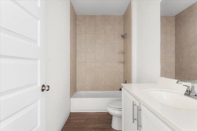8213 Spire Vw, Austin, TX 78744 - full bath with vanity, wood finished floors, and washtub / shower combination
