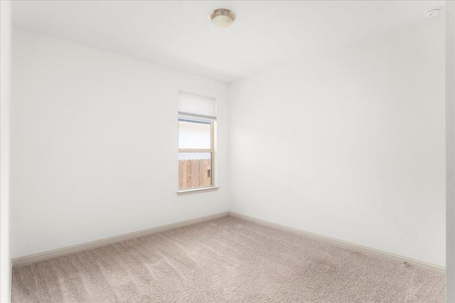 8213 Spire Vw, Austin, TX 78744 - carpeted spare room with baseboards