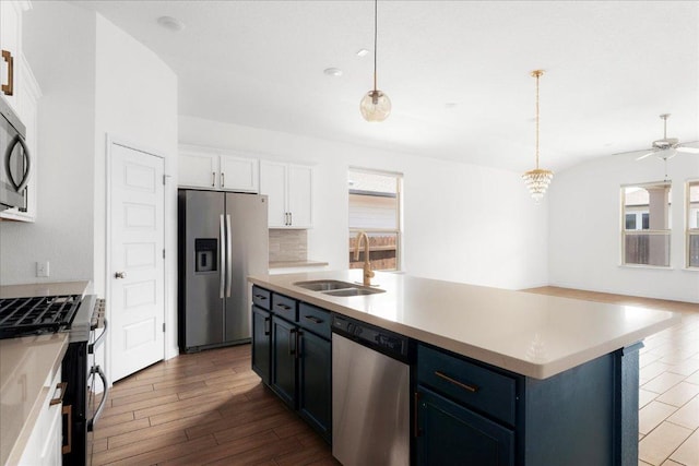 8213 Spire Vw, Austin, TX 78744 - kitchen with stainless steel appliances, healthy amount of natural light, dark wood-type flooring, and white cabinetry