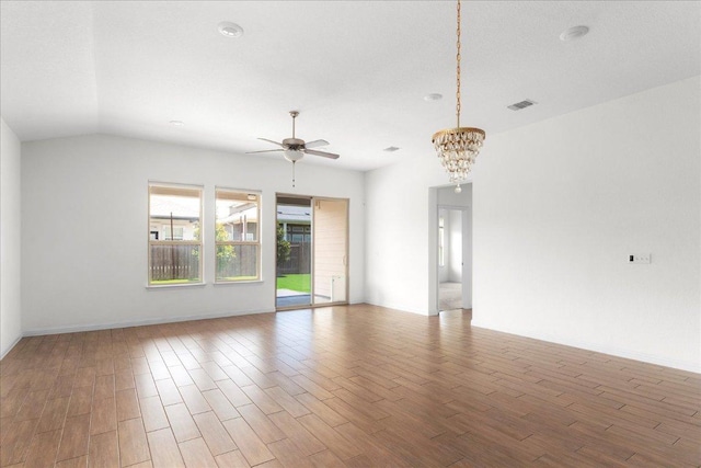 8213 Spire Vw, Austin, TX 78744 - unfurnished living room with a ceiling fan, wood finished floors, and a chandelier
