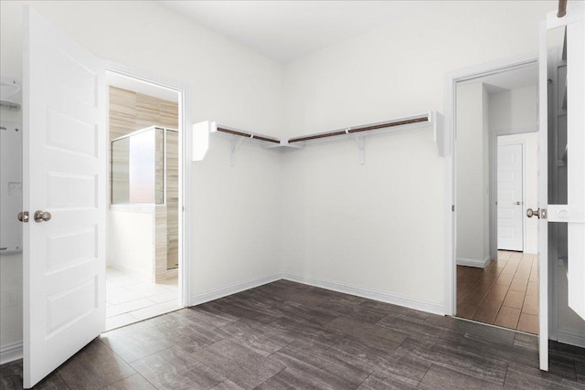 8213 Spire Vw, Austin, TX 78744 - walk in closet featuring dark wood-type flooring