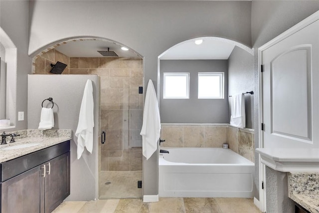 239 Holman Path, Hutto, TX 78634 - full bathroom featuring a shower stall, vanity, and a bath