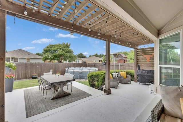 239 Holman Path, Hutto, TX 78634 - fenced backyard with a pergola, a patio, outdoor dining space, a hot tub, and an outdoor living space