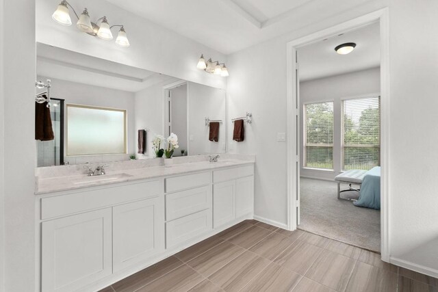 105 Sweetgum Cv, Bastrop, TX 78602 - full bathroom featuring double vanity and ensuite bathroom