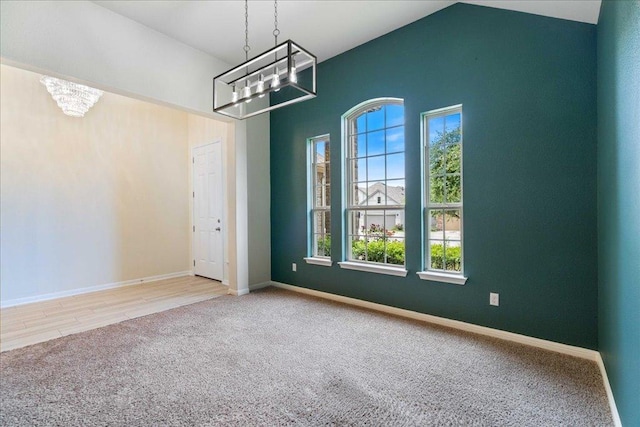 2520 Milan Meadows Dr, Leander, TX 78641 - unfurnished dining area with a chandelier, carpet, plenty of natural light, and vaulted ceiling