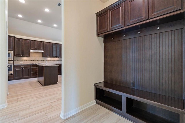 2520 Milan Meadows Dr, Leander, TX 78641 - mudroom with light wood finished floors and recessed lighting