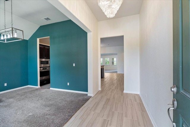 2520 Milan Meadows Dr, Leander, TX 78641 - foyer featuring a chandelier and light wood-style floors
