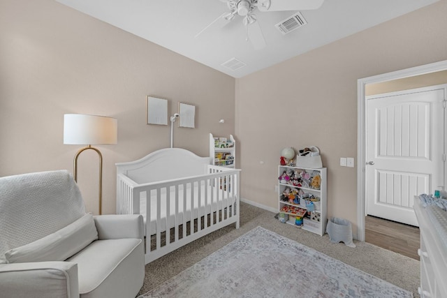 1420 Anhalt Dr Unit 50B, Pflugerville, TX 78660 - bedroom featuring a crib, carpet floors, and ceiling fan