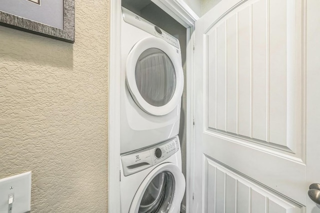 1420 Anhalt Dr Unit 50B, Pflugerville, TX 78660 - laundry area featuring stacked washer / dryer and a textured wall