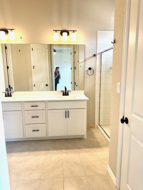 370 Milkwood Ter, Dripping Springs, TX 78620 - full bath with double vanity, a stall shower, and tile patterned floors
